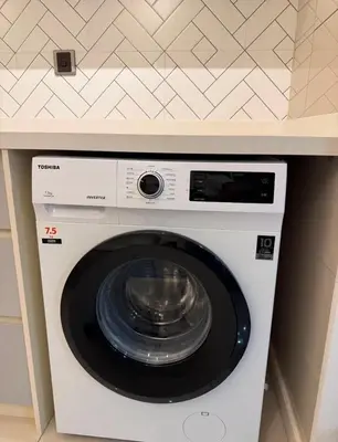 a washing machine with a bowl on top of it at Arte Mont Kiara by Skyline in Kuala Lumpur