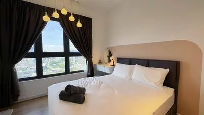 a bedroom with a white bed and a large window at M Vertica KL City Fully Air-Con Home in Kuala Lumpur
