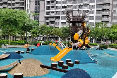 a playground in a city with a slide and swings at M Vertica KL City Fully Air-Con Home in Kuala Lumpur