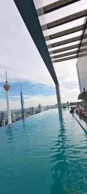 a swimming pool with a view of the city at platinum suites klcc By Palmas in Kuala Lumpur