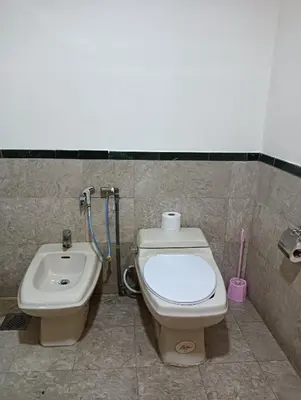 a bathroom with a toilet and a bidet at Crown Suits At Times Square in Kuala Lumpur