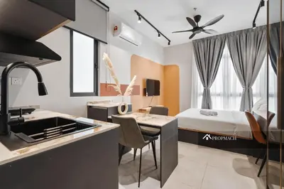 a kitchen and a bedroom with a bed in a room at Neu Suites By Propmach in Kuala Lumpur
