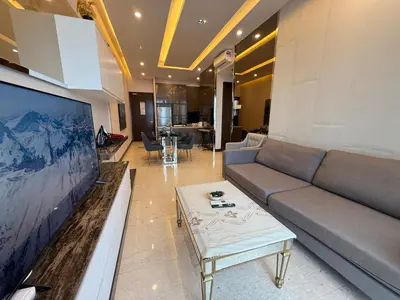 a living room with a couch and a coffee table at Crystal Dorsett Infinity Pool KL in Kuala Lumpur