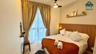 a bedroom with a large bed and a large window at Neu Suites by OKBnB in Kuala Lumpur