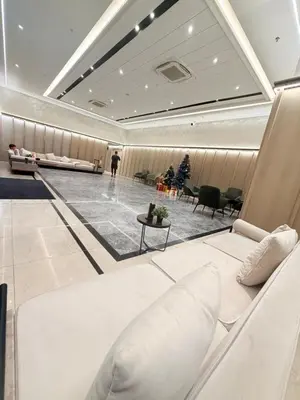 a waiting room with a white couch and chairs at Agile Bukit Bintang Suits TRX Pavilion By Klcc Sky view 60 floor in Kuala Lumpur