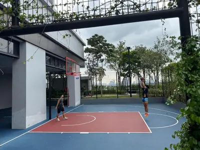 two people playing basketball on a basketball court at Trion KL TRX KLCC 6 Pax in Kuala Lumpur