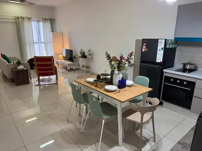 a kitchen with a table and chairs in a room at Trion KL TRX KLCC 6 Pax in Kuala Lumpur