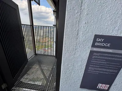 an open door to a balcony with a sky bridge at Trion KL TRX KLCC 6 Pax in Kuala Lumpur