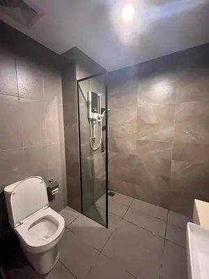 a bathroom with a shower and a toilet at Expressions Suite by Rudiman in Kuala Lumpur
