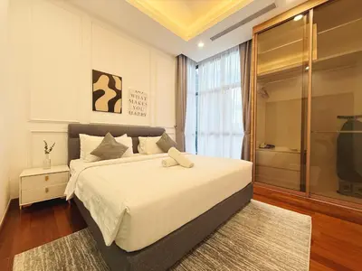 a bedroom with a large white bed and a window at DD Royce Residence KLCC in Kuala Lumpur