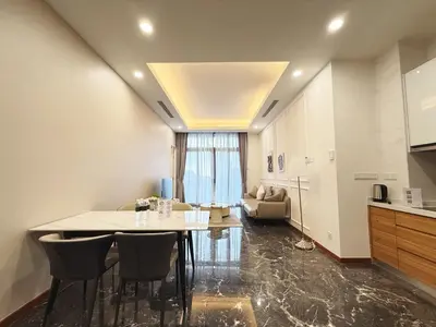 a kitchen and living room with a table and chairs at DD Royce Residence KLCC in Kuala Lumpur