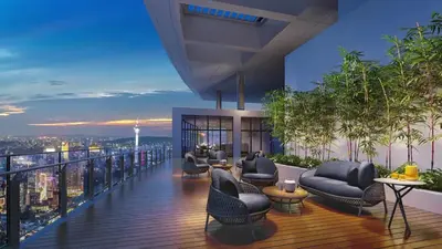 a balcony with couches and chairs on top of a building at \u4f0a\u987f\u9152\u5e97\u516c\u5bd3 in Kuala Lumpur