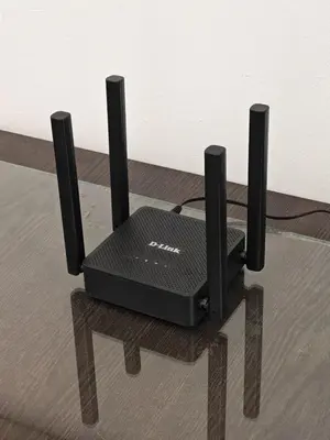 a black router sitting on top of a wooden floor at Urban Designer's Duplex in Ampang
