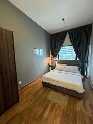 a bedroom with a large bed and a window at KLCC View Suites By Reizz Residence in Kuala Lumpur