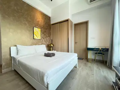 a bedroom with a large white bed in a room at The Colony By Infinitum D in Kuala Lumpur
