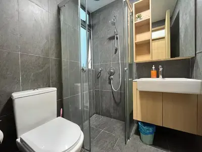 a bathroom with a shower and a toilet and a sink at The Colony By Infinitum G in Kuala Lumpur