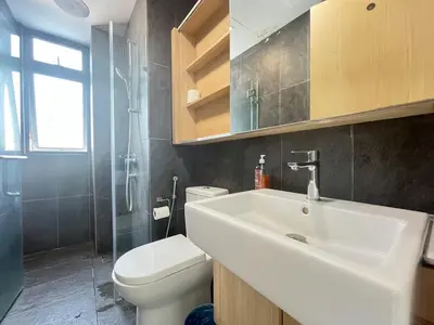 a bathroom with a white sink and a toilet at The Colony By Infinitum F in Kuala Lumpur