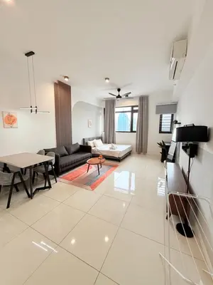 a living room with a couch and a table at Chambers Suites Mrk in Kuala Lumpur