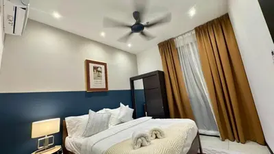 a bedroom with a bed with a ceiling fan at Comfy 2BR with FREE Parking at Neu Suites by OKBnB in Kuala Lumpur