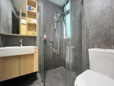 a bathroom with a shower and a toilet and a sink at The Colony By Infinitum H in Kuala Lumpur