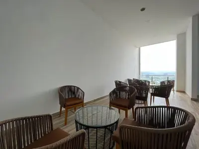 a room with chairs and tables and a window at The Colony By Infinitum C in Kuala Lumpur