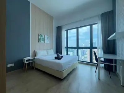 a bedroom with a large bed and a large window at The Colony By Infinitum C in Kuala Lumpur
