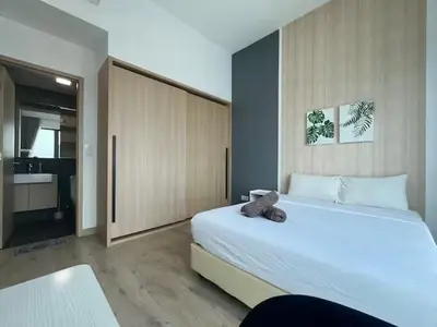 a bedroom with a bed with a teddy bear on it at The Colony By Infinitum C in Kuala Lumpur