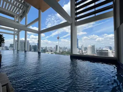 a swimming pool with a view of the city at The Colony By Infinitum A in Kuala Lumpur