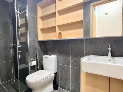 a bathroom with a toilet and a sink at The Colony By Infinitum J in Kuala Lumpur
