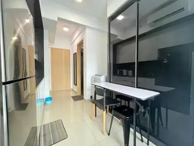 a kitchen with a table and chairs in a room at The Colony By Infinitum M in Kuala Lumpur