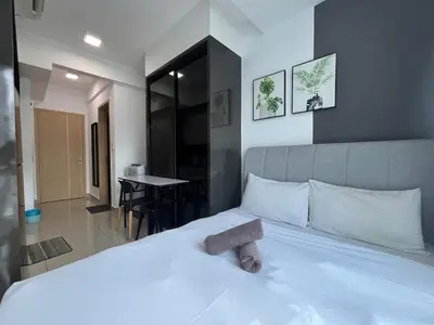 a bedroom with a bed with a stuffed animal on it at The Colony By Infinitum M in Kuala Lumpur