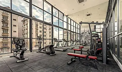 a gym with a bunch of machines in a building at New 5 min Gleneagles Hospital 10 min KLCC in Kuala Lumpur