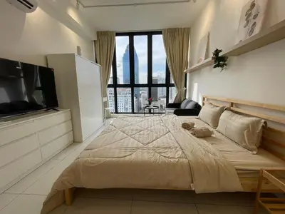 a large bedroom with a large bed and a tv at Majestic Residence by Aranova Stay in Kuala Lumpur