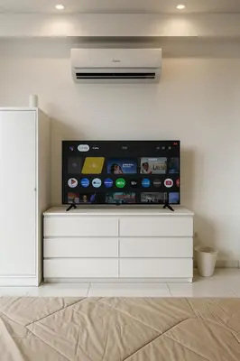 a flat screen tv sitting on top of a white dresser at Majestic Residence by Aranova Stay in Kuala Lumpur