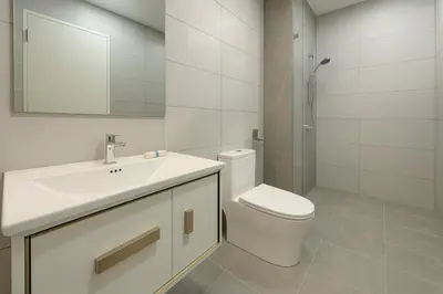 a bathroom with a toilet and a sink and a shower at Majestic Residence by Aranova Stay in Kuala Lumpur