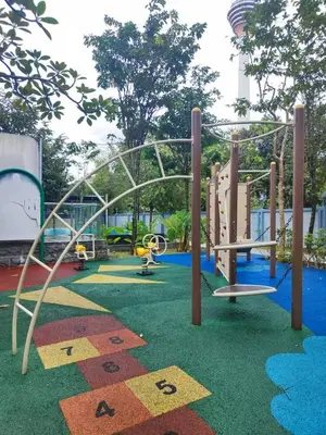 a playground with a slide and a roller coaster at Suasana Bukit Ceylon with Panda Themes KL Tower View in Kuala Lumpur
