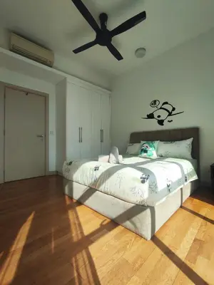 a bedroom with a bed and a ceiling fan at Suasana Bukit Ceylon with Panda Themes KL Tower View in Kuala Lumpur