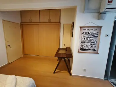 a room with a door and a table on a wall at Fahrenheit 88 Pavilion TRX 2 BedRoom 2 Bathroom Bukit Bintang in Kuala Lumpur