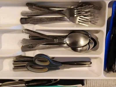 a drawer filled with utensils and spoons at Fahrenheit 88 Pavilion TRX 2 BedRoom 2 Bathroom Bukit Bintang in Kuala Lumpur