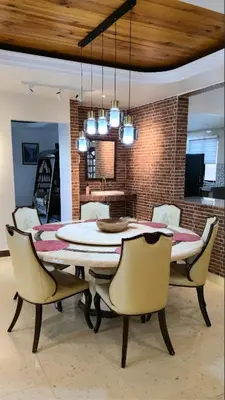 a dining room with a table and chairs at Gasing WheelHouse in Petaling Jaya