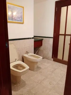 a bathroom with a toilet and a bidet at Afrin Service Suits at Berjaya Times Square in Kuala Lumpur