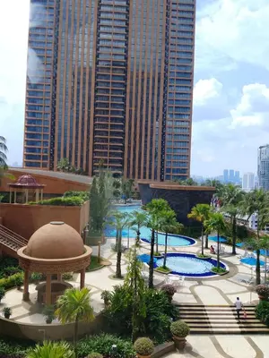 a view of a pool in a city with tall buildings at Afrin Service Suits at Berjaya Times Square in Kuala Lumpur