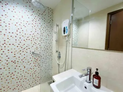 a bathroom with a sink and a shower at Regalia Studio apartment in Kuala Lumpur