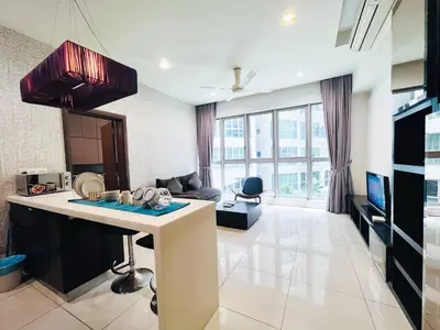 a kitchen and living room with a large window at Regalia Studio apartment in Kuala Lumpur