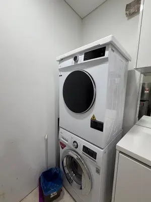 a washer and dryer in a small room at Vortex suites klcc by 2 bed 3 bed family suites vibes in Kuala Lumpur