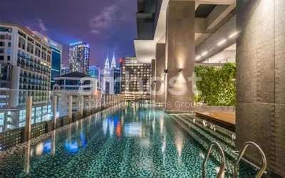 a swimming pool on top of a building with a city skyline at Anggun Residence KLCC by Airhost in Kuala Lumpur
