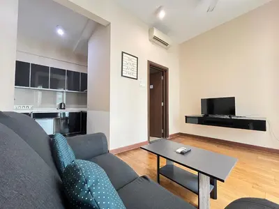 a living room with a couch and a table at Homestay Walking Distance to PWTC in Kuala Lumpur
