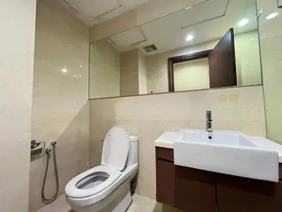 a bathroom with a white toilet and a sink at Homestay Walking Distance to PWTC in Kuala Lumpur