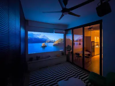 a room with a television with a view of a lake at Majestic Residence Infinity Pool with KLCC View in Kuala Lumpur