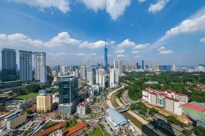 a city with tall buildings and a city at Delightful Studio Suite in Kuala Lumpur